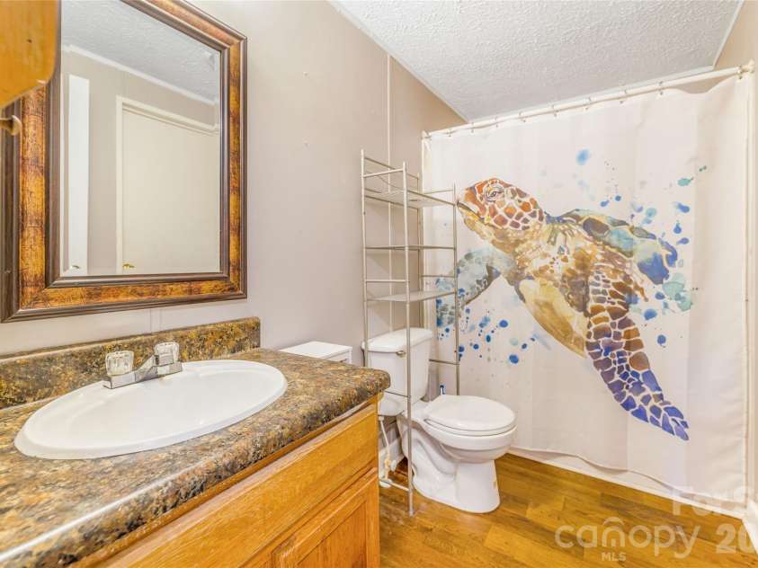 140 Crows nest Road, Hendersonville, NC 28791.  MLS# CAR4331397, YatesRealty ID 6016. Hall bathroom 