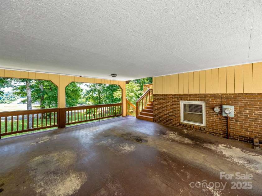 29 Tall Oaks Road, Candler, NC 28715.  MLS# CAR4163907, YatesRealty ID 6016. Large Covered 2 car - attached carport