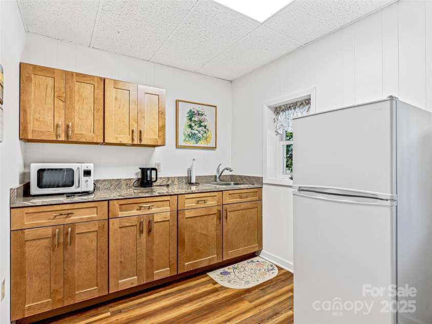 29 Tall Oaks Road, Candler, NC 28715.  MLS# CAR4163907, YatesRealty ID 6016. Lower level kitchenette
