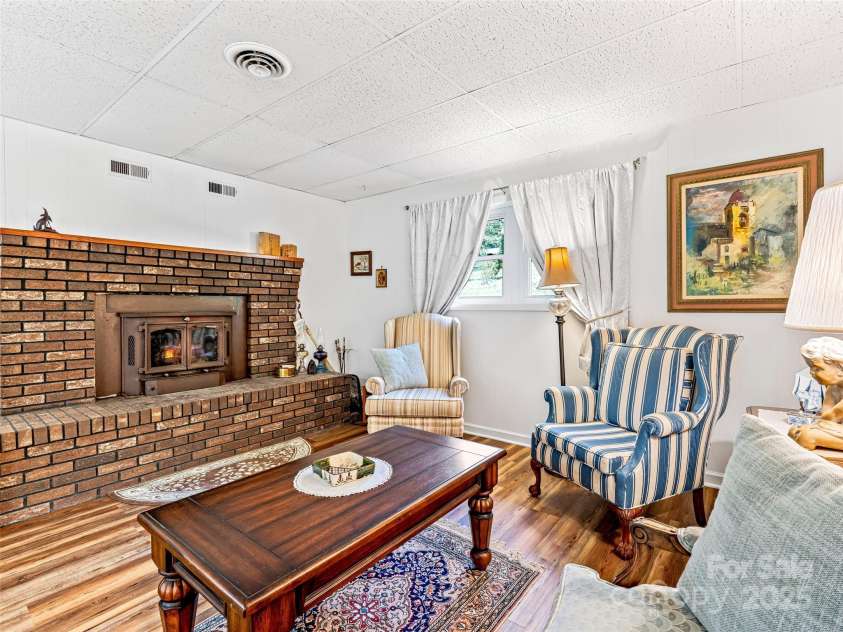 29 Tall Oaks Road, Candler, NC 28715.  MLS# CAR4163907, YatesRealty ID 6016. Lower Level living room