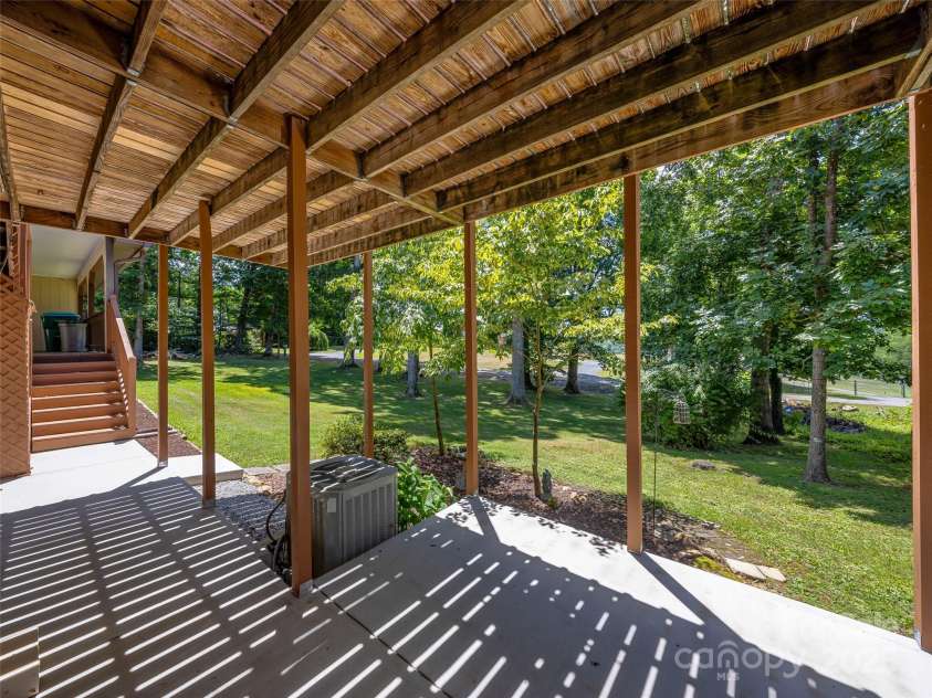 29 Tall Oaks Road, Candler, NC 28715.  MLS# CAR4163907, YatesRealty ID 6016. Lower level patio