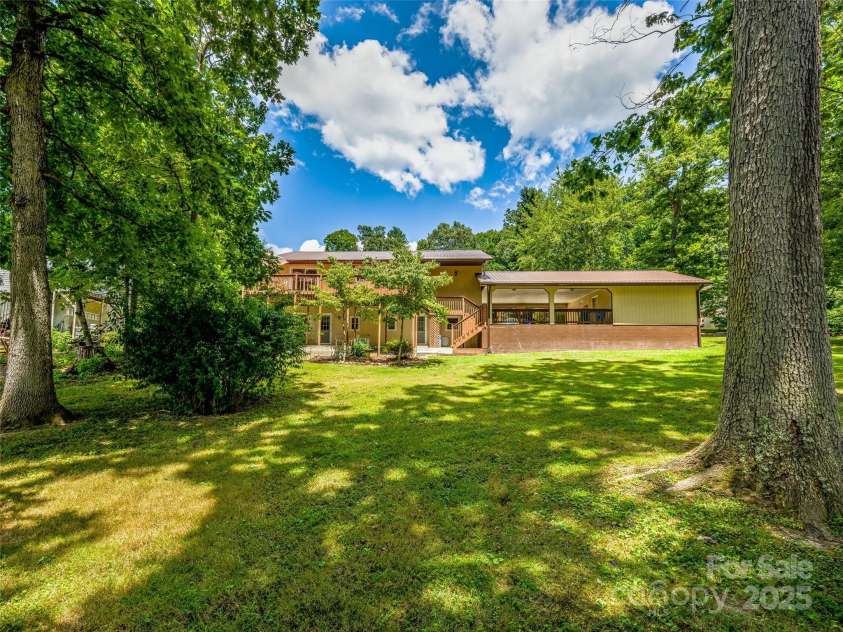 29 Tall Oaks Road, Candler, NC 28715.  MLS# CAR4163907, YatesRealty ID 6016. Room to run! backyard view