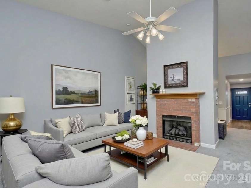 1104 Deermouse Way, Hendersonville, NC 28792.  MLS# CAR4296698, YatesRealty ID 6018. Living room with gas fireplace - virtually staged