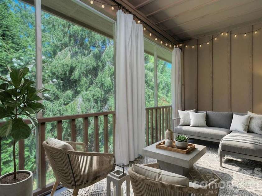 1104 Deermouse Way, Hendersonville, NC 28792.  MLS# CAR4296698, YatesRealty ID 6018. Lovely covered and screened back porch -virtually staged
