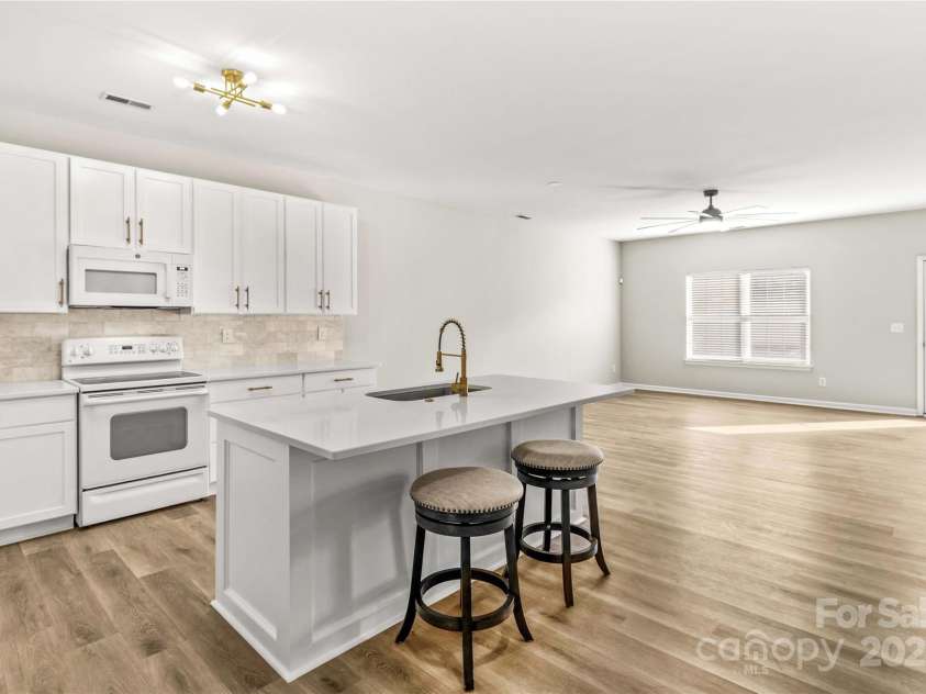124 Zolder Lane, Mooresville, NC 28117.  MLS# CAR4213674, YatesRealty ID 6019. Kitchen and open living area