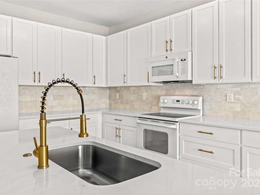 124 Zolder Lane, Mooresville, NC 28117.  MLS# CAR4213674, YatesRealty ID 6019. Kitchen island and new cabinetry