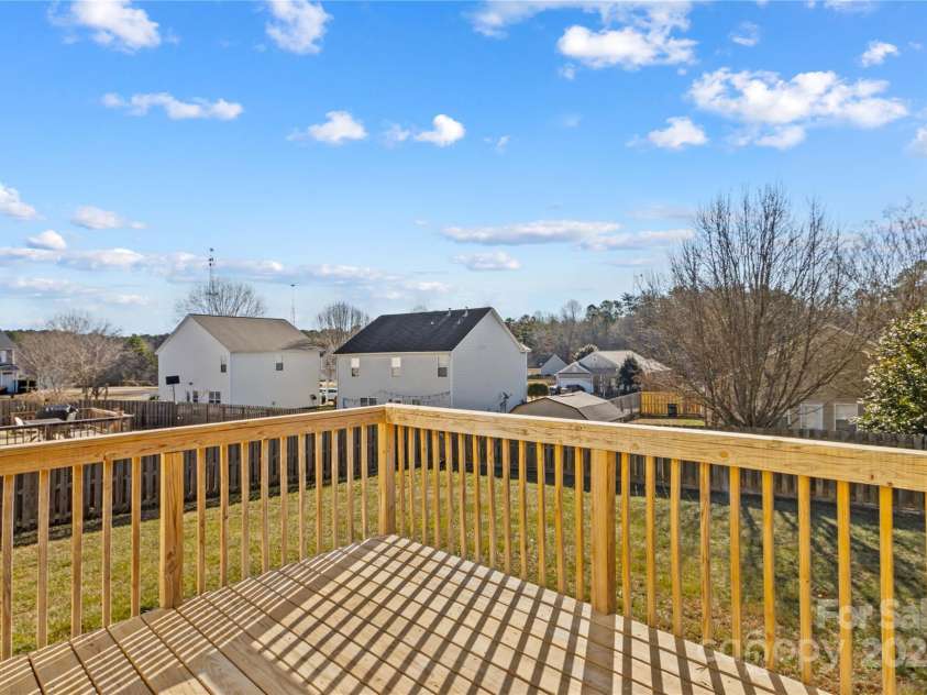 124 Zolder Lane, Mooresville, NC 28117.  MLS# CAR4213674, YatesRealty ID 6019. Rear deck overlooking fenced in yard