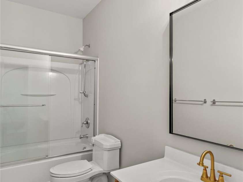 124 Zolder Lane, Mooresville, NC 28117.  MLS# CAR4213674, YatesRealty ID 6019. Secondary Bath with tile flooring, new hardware