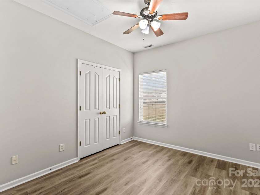 124 Zolder Lane, Mooresville, NC 28117.  MLS# CAR4213674, YatesRealty ID 6019. Side Bedroom #3, with ceiling fan and LCP flooring