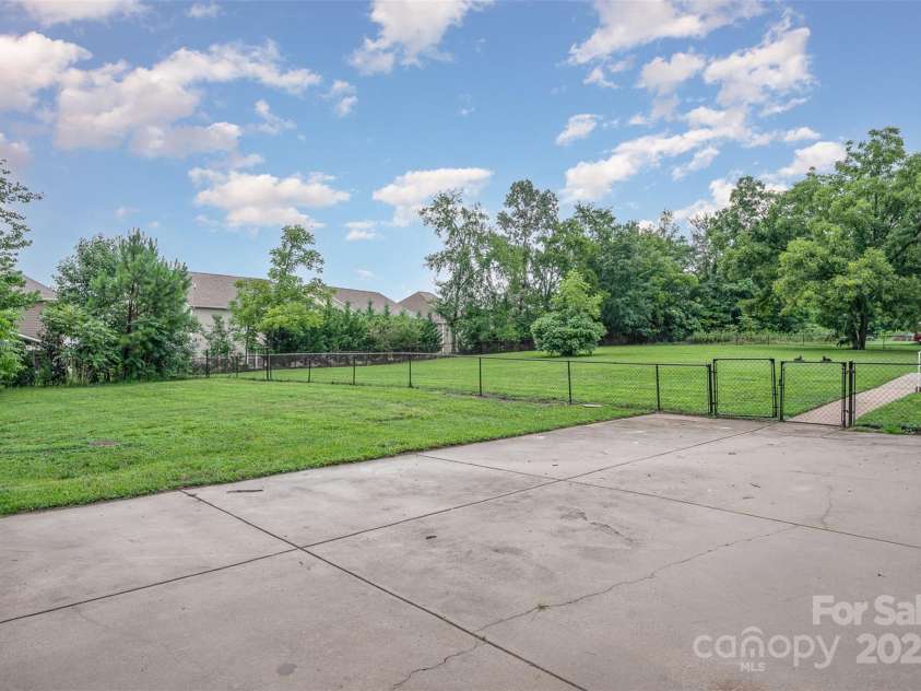 16308 Poplar Tent Road, Huntersville, NC 28078.  MLS# CAR4302372, YatesRealty ID 6033. Parking area and backyard