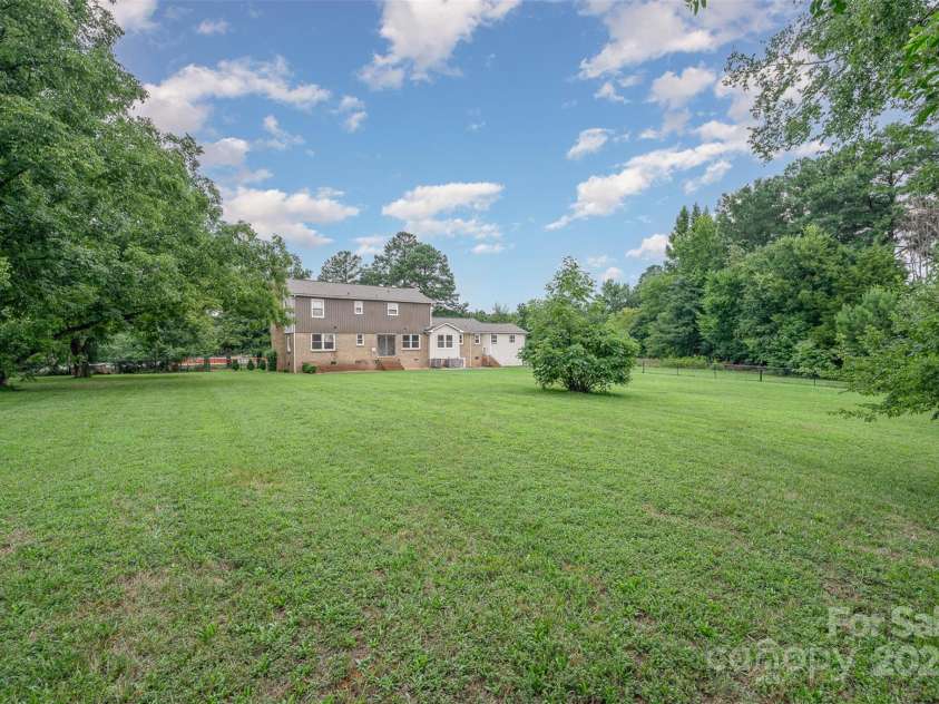 16308 Poplar Tent Road, Huntersville, NC 28078.  MLS# CAR4302372, YatesRealty ID 6033. Rear view of house