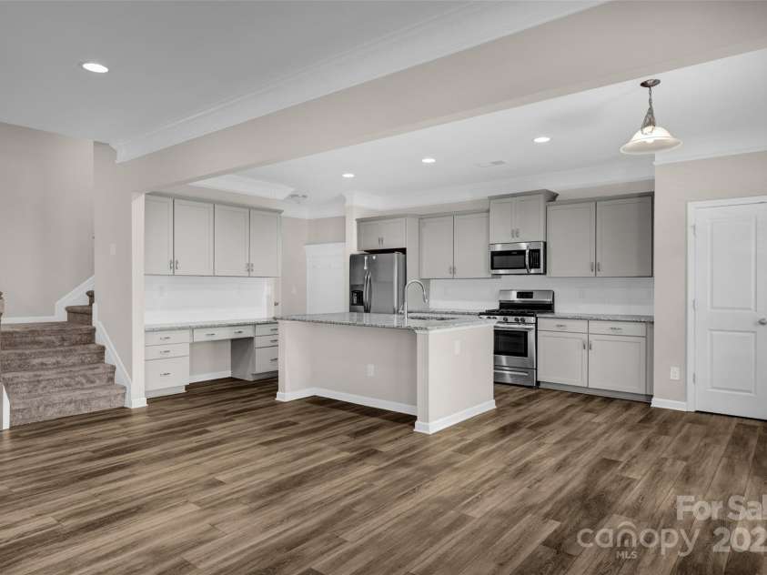 111 Bell Chase Lane, Statesville, NC 28677.  MLS# CAR4233934, YatesRealty ID 6035. Open kitchen with center island and desk space.