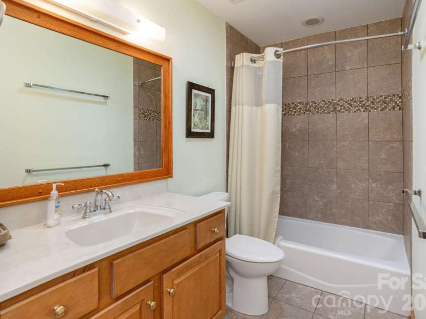 524 Three Mile Knob Road, Pisgah Forest, NC 28768.  MLS# CAR4361023, YatesRealty ID 6052. Guest Bathroom