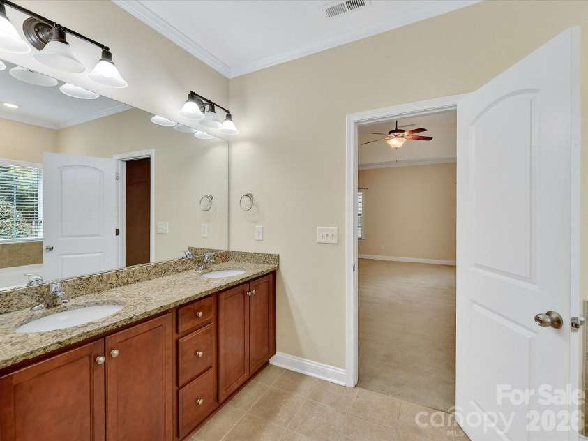 21277 Summerbrook Drive, Cornelius, NC 28031.  MLS# CAR4355875, YatesRealty ID 6062. En-suite Primary Bathroom with dual sinks