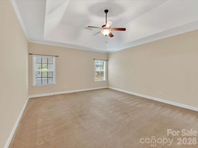 21277 Summerbrook Drive, Cornelius, NC 28031.  MLS# CAR4355875, YatesRealty ID 6062. Large Primary Bedroom on the main level with tray ceiling