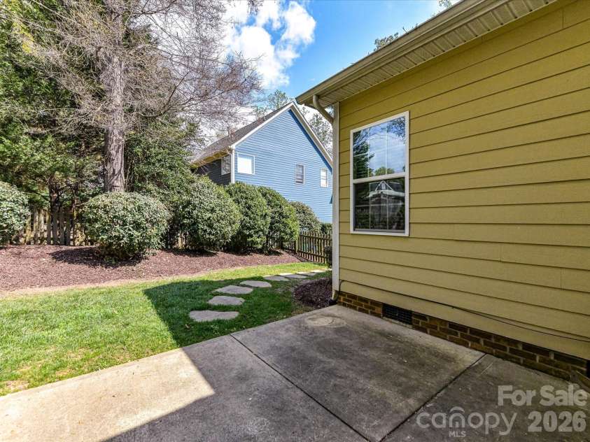 21277 Summerbrook Drive, Cornelius, NC 28031.  MLS# CAR4355875, YatesRealty ID 6062. Patio and walkway from rear fenced yard