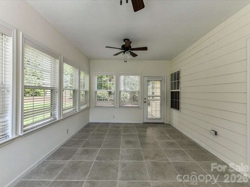 21277 Summerbrook Drive, Cornelius, NC 28031.  MLS# CAR4355875, YatesRealty ID 6062. Sun room with views of the backyard