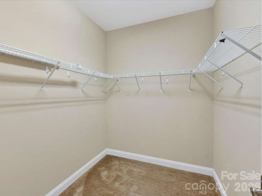 21277 Summerbrook Drive, Cornelius, NC 28031.  MLS# CAR4355875, YatesRealty ID 6062. Walk-in primary bedroom closet
