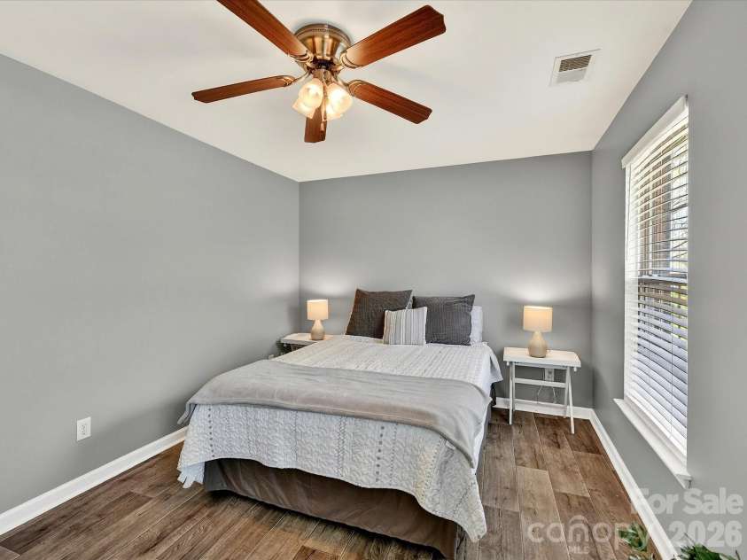 12305 Chickasaw Drive, Huntersville, NC 28078.  MLS# CAR4359393, YatesRealty ID 6064. Comfortable third bedroom featuring neutral finishes, natural light, and a versatile layout ideal for guests or additional living space.