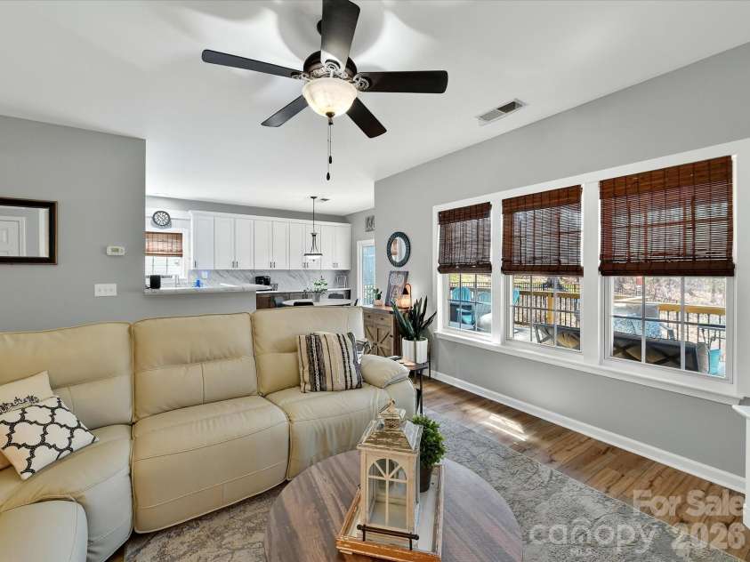 12305 Chickasaw Drive, Huntersville, NC 28078.  MLS# CAR4359393, YatesRealty ID 6064. Open-concept great room seamlessly flows into the kitchen, creating a bright and functional space ideal for everyday living and entertaining.
