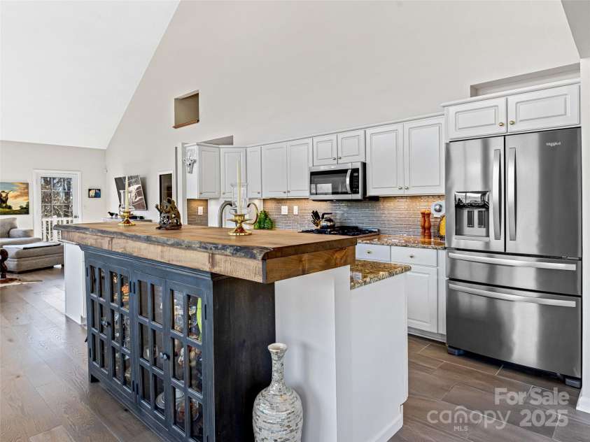 150 Hobby Horse Lane, Hendersonville, NC 28792.  MLS# CAR4241391, YatesRealty ID 6072. Custom Island with live edge and lit buffet
