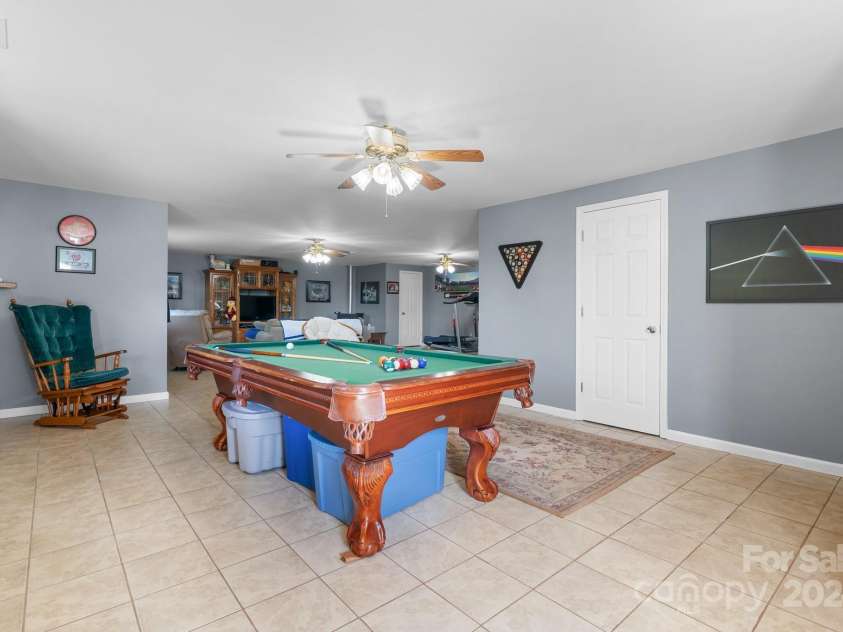 6833 Burkemont Road, Morganton, NC 28655.  MLS# CAR4189958, YatesRealty ID 6073. Basement Family room ...Pool table stays