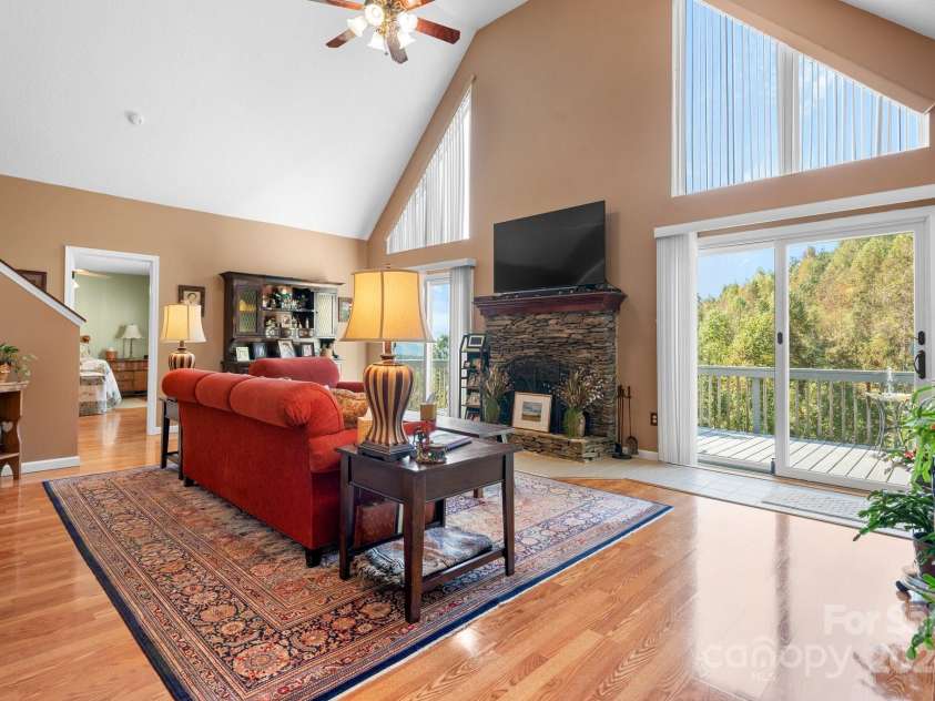 6833 Burkemont Road, Morganton, NC 28655.  MLS# CAR4189958, YatesRealty ID 6073. Living Room with vaulted ceilings and stone fireplace