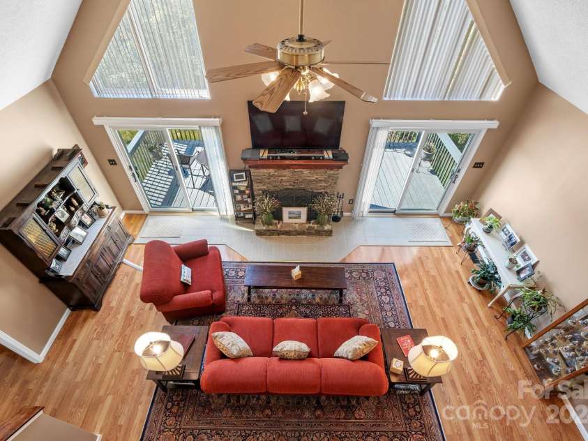6833 Burkemont Road, Morganton, NC 28655.  MLS# CAR4189958, YatesRealty ID 6073. Looking into the living room from the loft!! Lots of windows and all new exterior doors in this home.