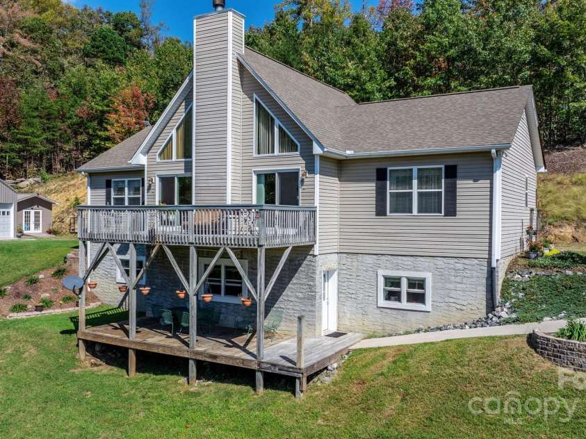 6833 Burkemont Road, Morganton, NC 28655.  MLS# CAR4189958, YatesRealty ID 6073. Lower deck off basement for relaxing and watching all the wildlife that may stroll through your yard!!