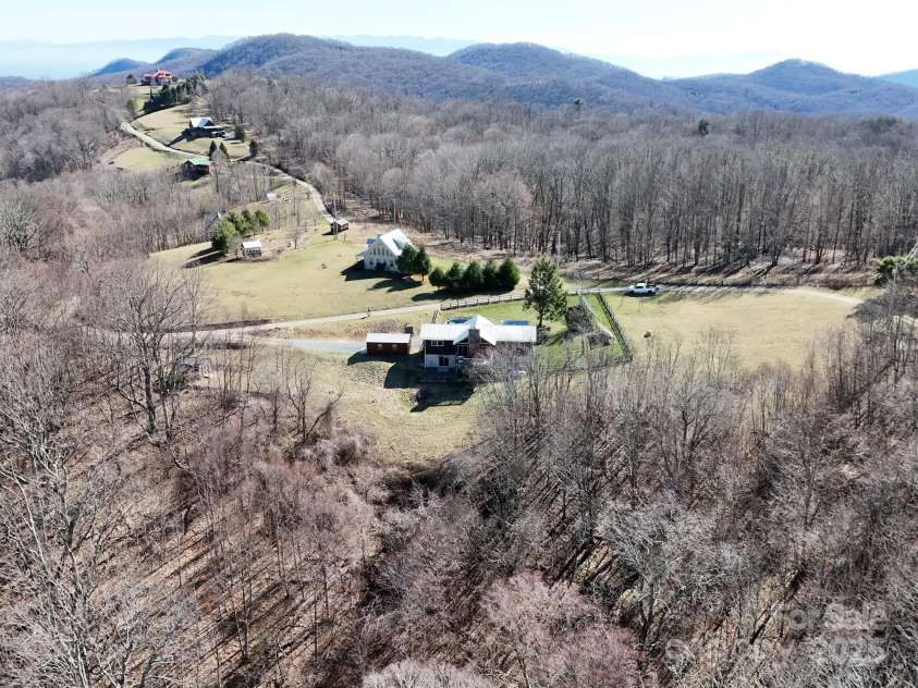 672/715 Windswept Ridge Road, Canton, NC 28716.  MLS# CAR4229345, YatesRealty ID 6077. Aerial View front and side facing of complete property