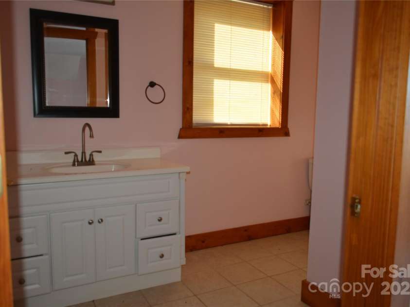 672/715 Windswept Ridge Road, Canton, NC 28716.  MLS# CAR4229345, YatesRealty ID 6077. House #1 - Full bath in the basement bedroom.