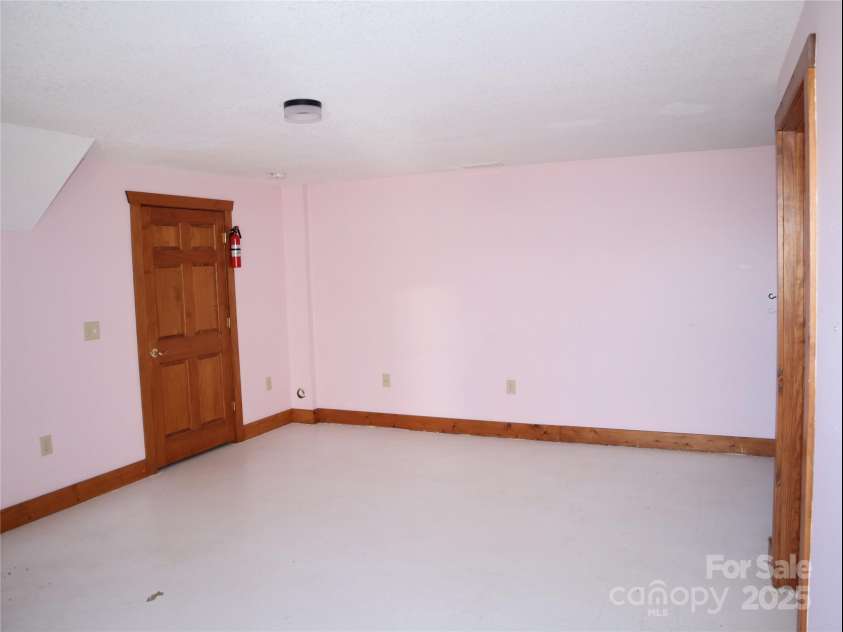 672/715 Windswept Ridge Road, Canton, NC 28716.  MLS# CAR4229345, YatesRealty ID 6077. House #1 - Large bedroom in basement.