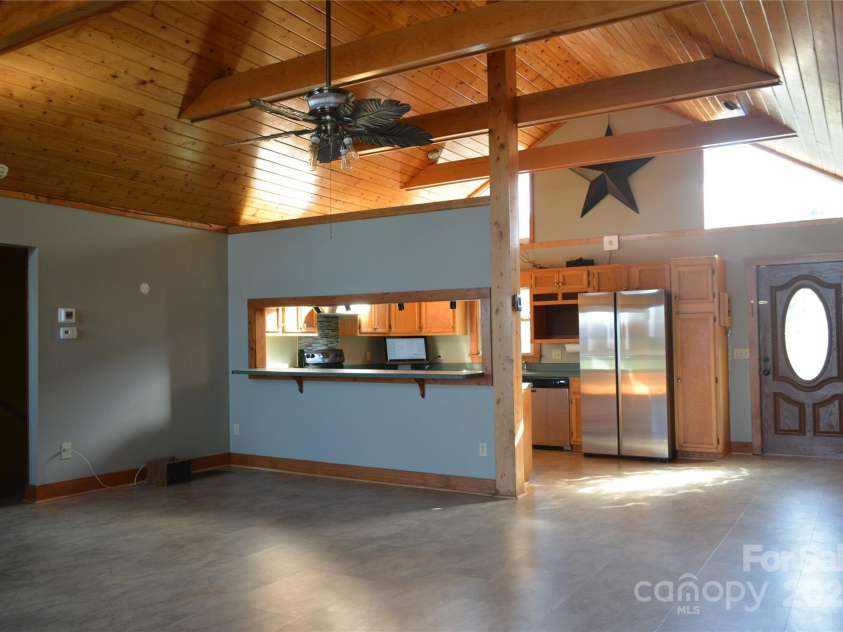 672/715 Windswept Ridge Road, Canton, NC 28716.  MLS# CAR4229345, YatesRealty ID 6077. House #1 - Open kitchen and living room. Featuring also a dining area.