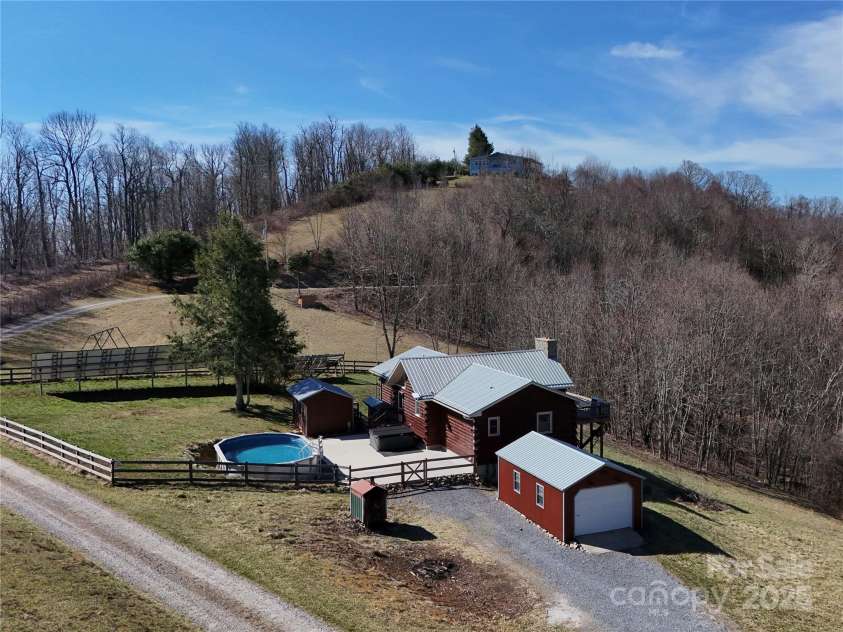 672/715 Windswept Ridge Road, Canton, NC 28716.  MLS# CAR4229345, YatesRealty ID 6077. House #1 side view - large fenced in patio.