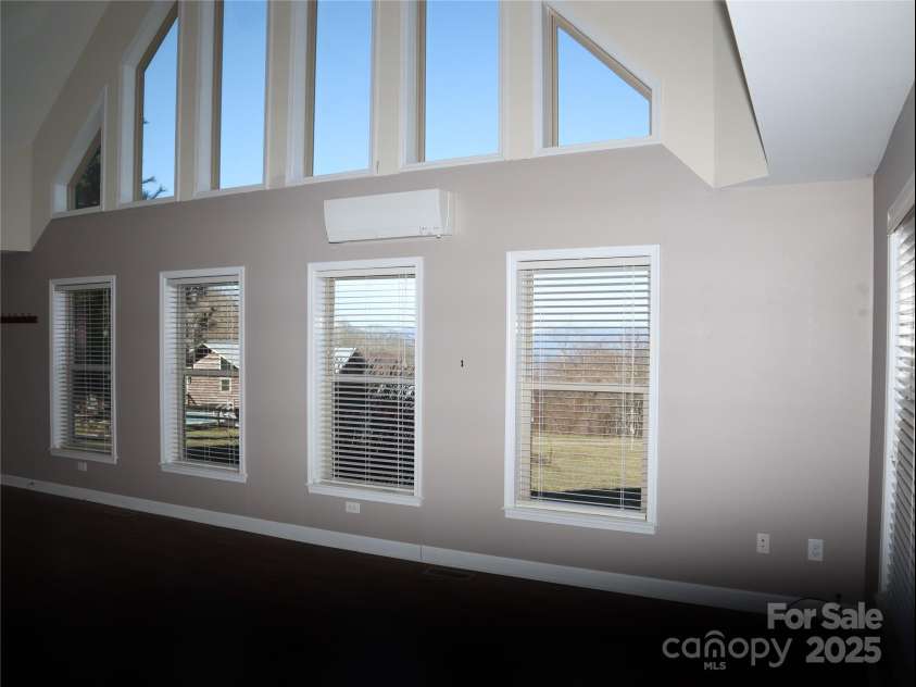 672/715 Windswept Ridge Road, Canton, NC 28716.  MLS# CAR4229345, YatesRealty ID 6077. House #2 - Large windows in the open living area.