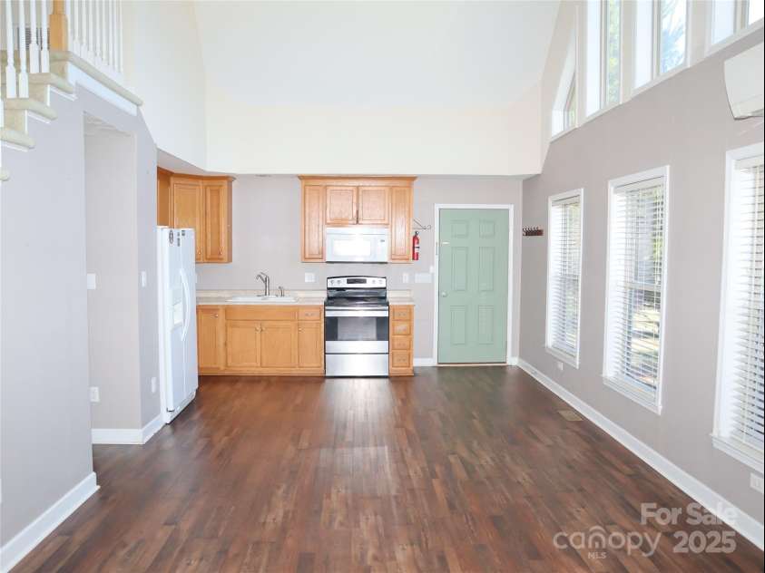 672/715 Windswept Ridge Road, Canton, NC 28716.  MLS# CAR4229345, YatesRealty ID 6077. House #2 - Open Kitchen and Living area with large windows.