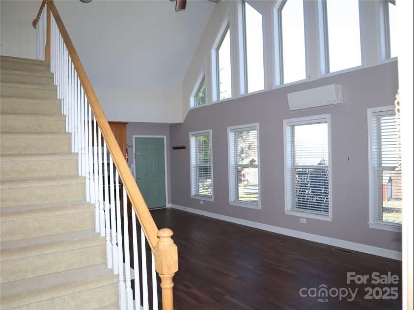 672/715 Windswept Ridge Road, Canton, NC 28716.  MLS# CAR4229345, YatesRealty ID 6077. House #2 - Stairs leading to upstairs bedroom.  The open living room and Kitchen to right of stairway.