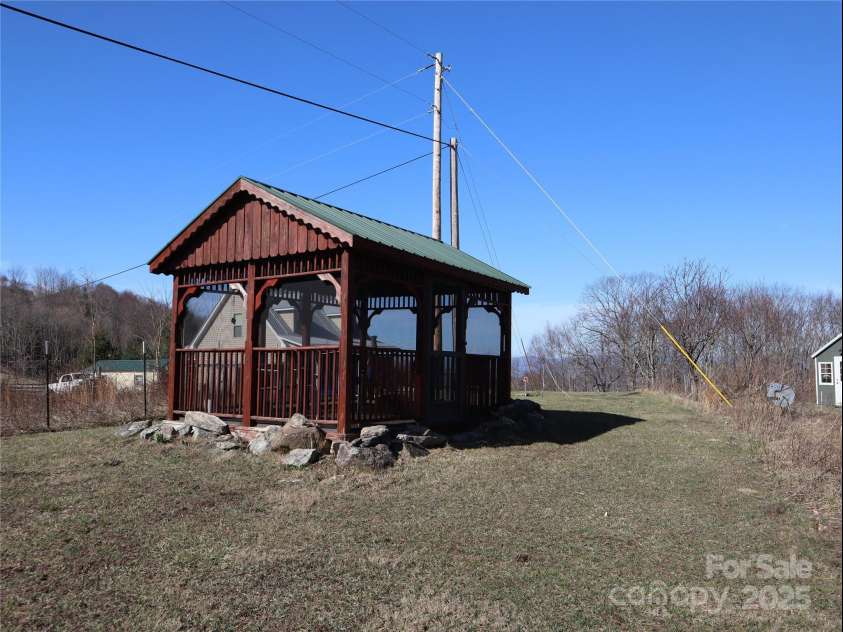 672/715 Windswept Ridge Road, Canton, NC 28716.  MLS# CAR4229345, YatesRealty ID 6077. Screened gazebo with lots of space to look at beautiful views.