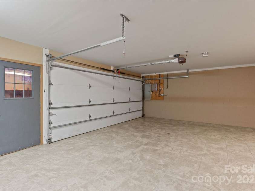 29 Down To Earth Drive, Burnsville, NC 28714.  MLS# CAR4217184, YatesRealty ID 608. Basement Garage