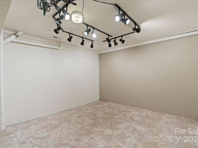 29 Down To Earth Drive, Burnsville, NC 28714.  MLS# CAR4217184, YatesRealty ID 608. Basement Room