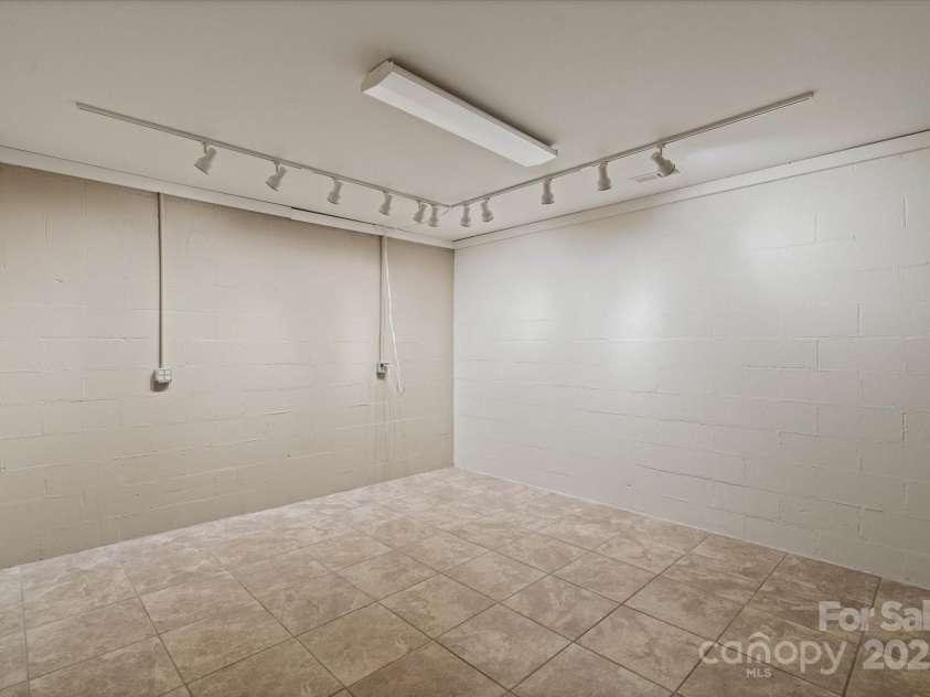 29 Down To Earth Drive, Burnsville, NC 28714.  MLS# CAR4217184, YatesRealty ID 608. Basement Room
