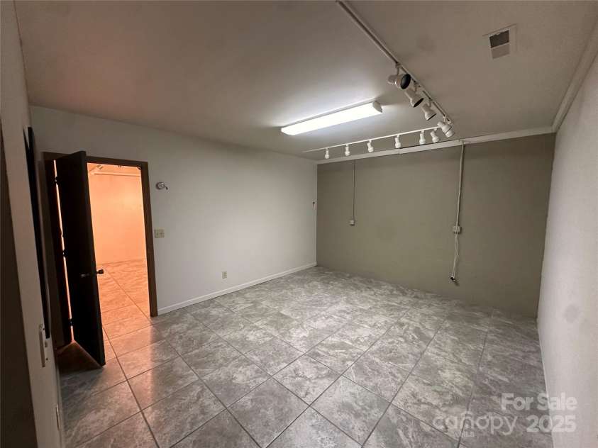 29 Down To Earth Drive, Burnsville, NC 28714.  MLS# CAR4217184, YatesRealty ID 608. Basement Room