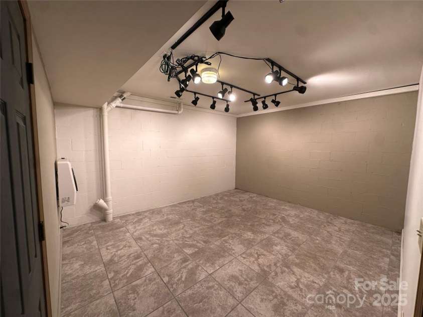 29 Down To Earth Drive, Burnsville, NC 28714.  MLS# CAR4217184, YatesRealty ID 608. Basement Room