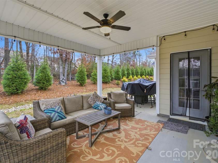 2310 Old Evergreen Parkway, Indian Trail, NC 28079.  MLS# CAR4327341, YatesRealty ID 6088. Covered back porch- tree line creates privacy