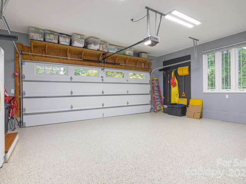231 Kimberly Ann Drive, Hendersonville, NC 28792.  MLS# CAR4285461, YatesRealty ID 6092. Heated garage, pristine epoxy floor