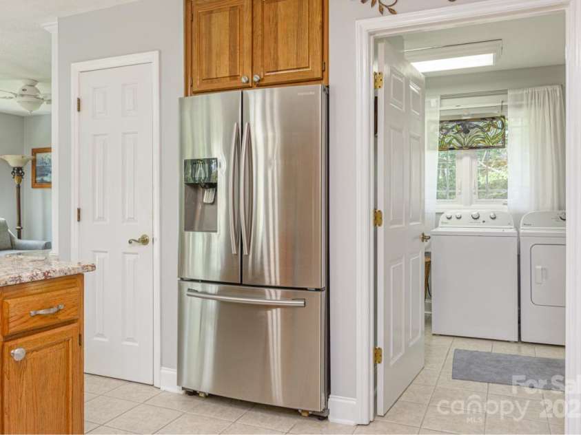 231 Kimberly Ann Drive, Hendersonville, NC 28792.  MLS# CAR4285461, YatesRealty ID 6092. Kitchen, looking into laundry area