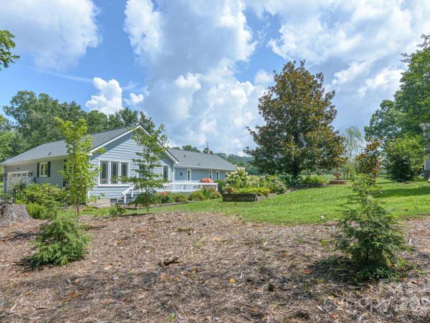231 Kimberly Ann Drive, Hendersonville, NC 28792.  MLS# CAR4285461, YatesRealty ID 6092. Relaxing back yard. Visit today!