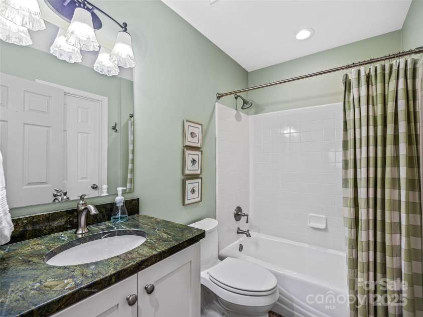 73 Ridgetop Circle, Brevard, NC 28712.  MLS# CAR4307459, YatesRealty ID 6094. Guest bath