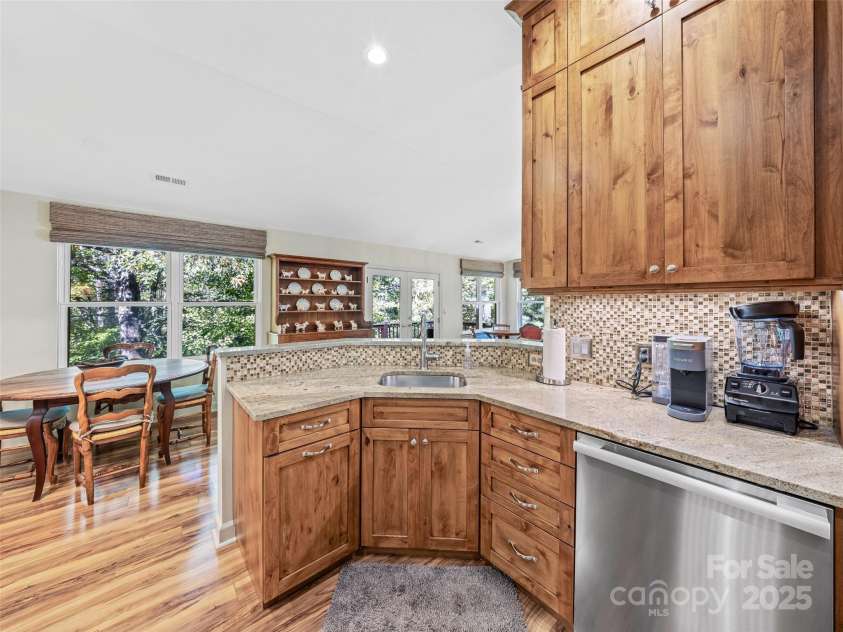 73 Ridgetop Circle, Brevard, NC 28712.  MLS# CAR4307459, YatesRealty ID 6094. Open to the great room yet hidden prep area