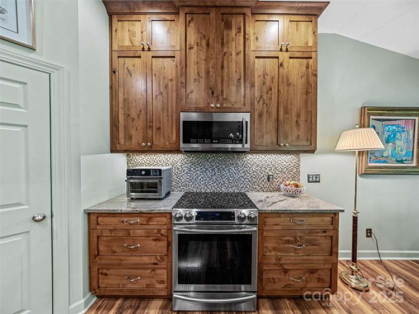 73 Ridgetop Circle, Brevard, NC 28712.  MLS# CAR4307459, YatesRealty ID 6094. Upgraded cabinets with undercounter lighting